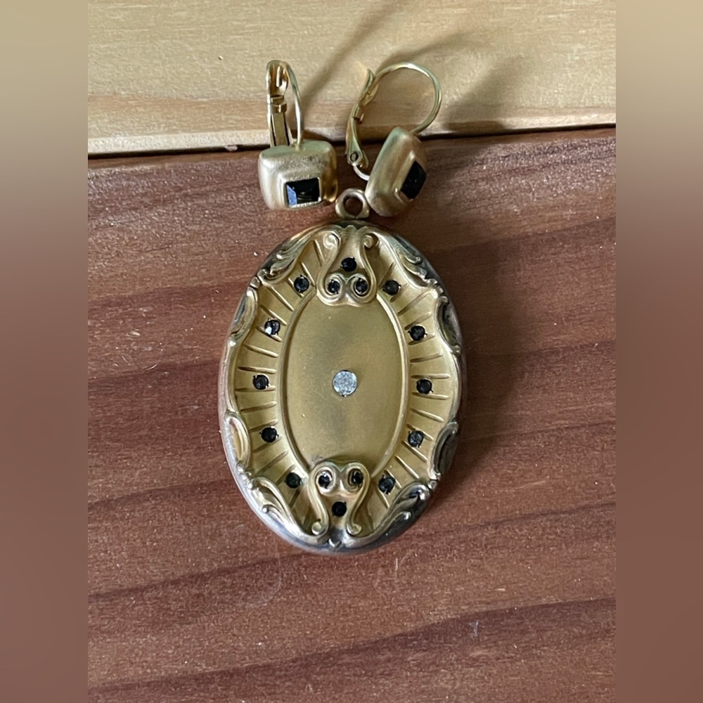 Antique CQR Locket in an oval shape 1.75x1.25”.